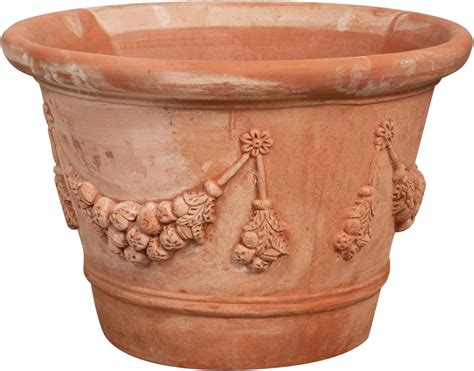 Vaso di terracotta con piantina di peperone