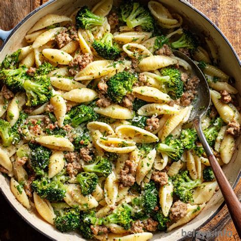 Close-up of a rustic Italian dish with sausage and broccoli