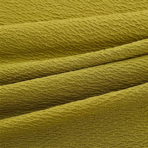 Tessuto crepe con texture granulosa
