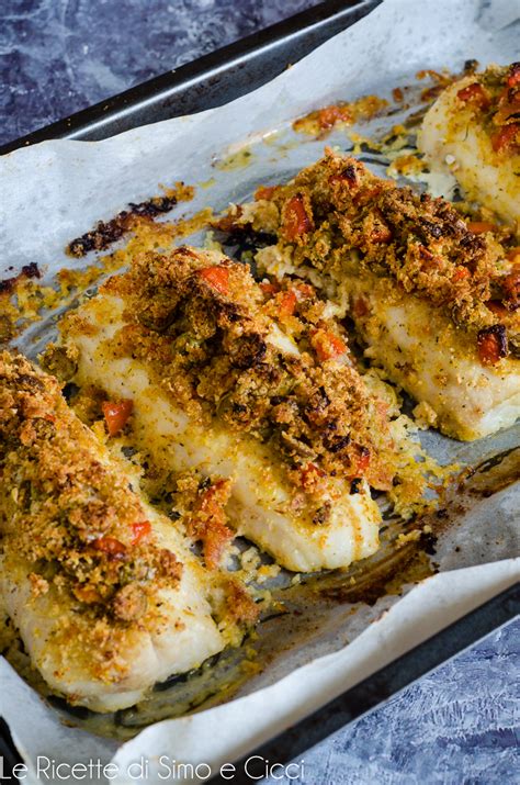 Merluzzo gratinato su un letto di spinaci e pomodorini