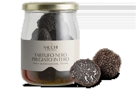 Vasetto di vetro con tartufo nero ricoperto di riso