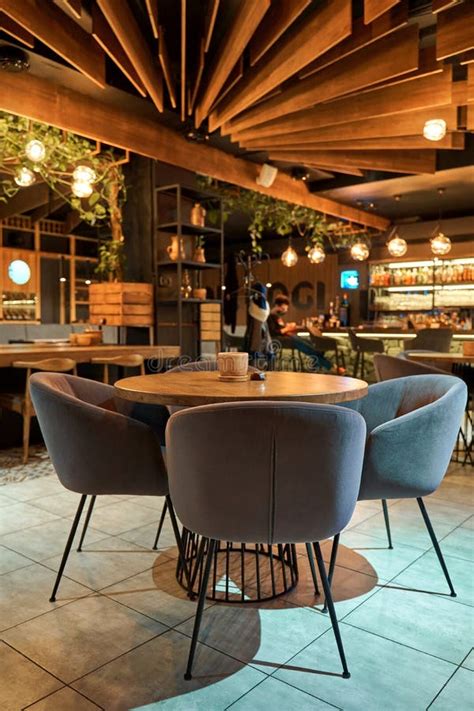 Interior view of a cozy restaurant with tables and soft lighting